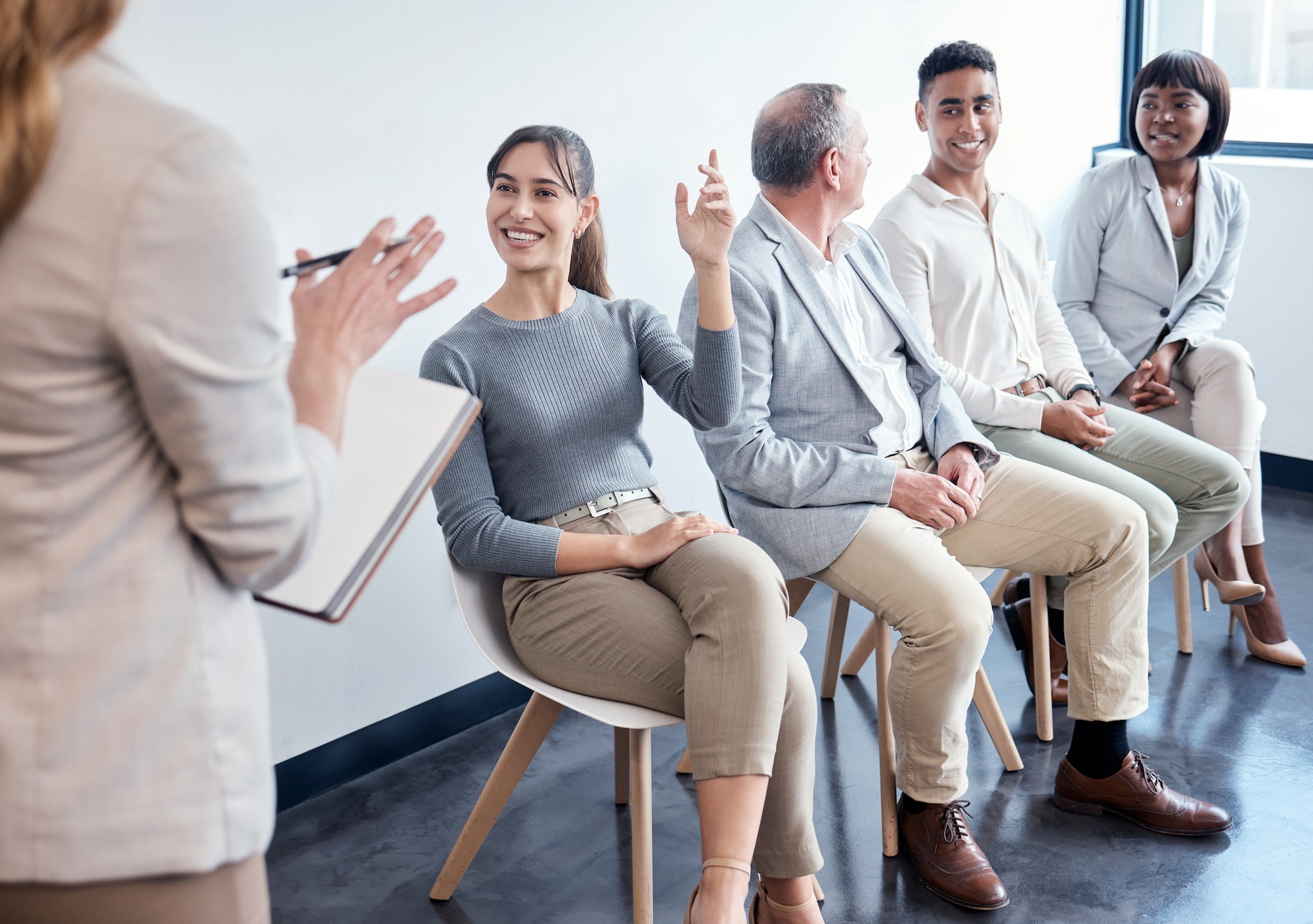 shot-of-a-group-of-new-employees-having-a-discussion-with-the-recruiter-at-an-office.jpg