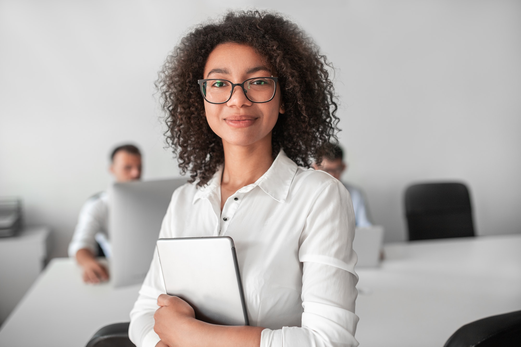 smiling-ethnic-female-recruiter-with-tablet-looking-at-camera-in-office.jpg smiling-ethnic-female-recruiter-with-tablet-looking-at-camera-in-office.jpg